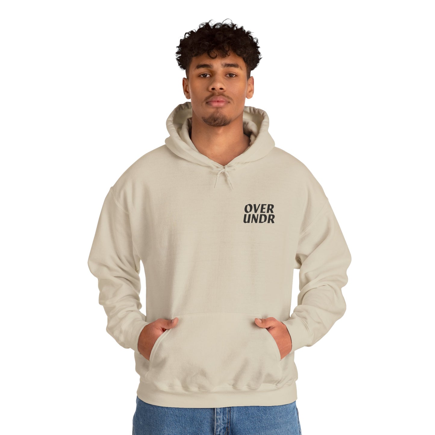 Person wearing a beige hoodie with 'OVER UNDER' text on a white background